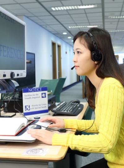 People reading books using computer